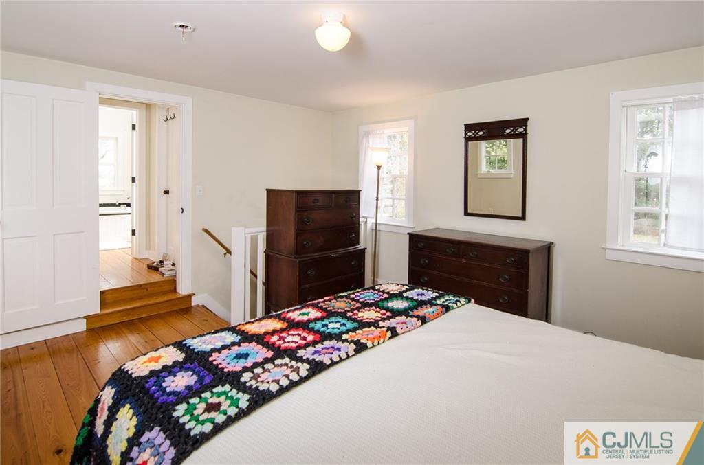 168 Plainsboro Road Cranbury, NJ 08512 - Photo 21 of 25 a bedroom with a bed and a dresser