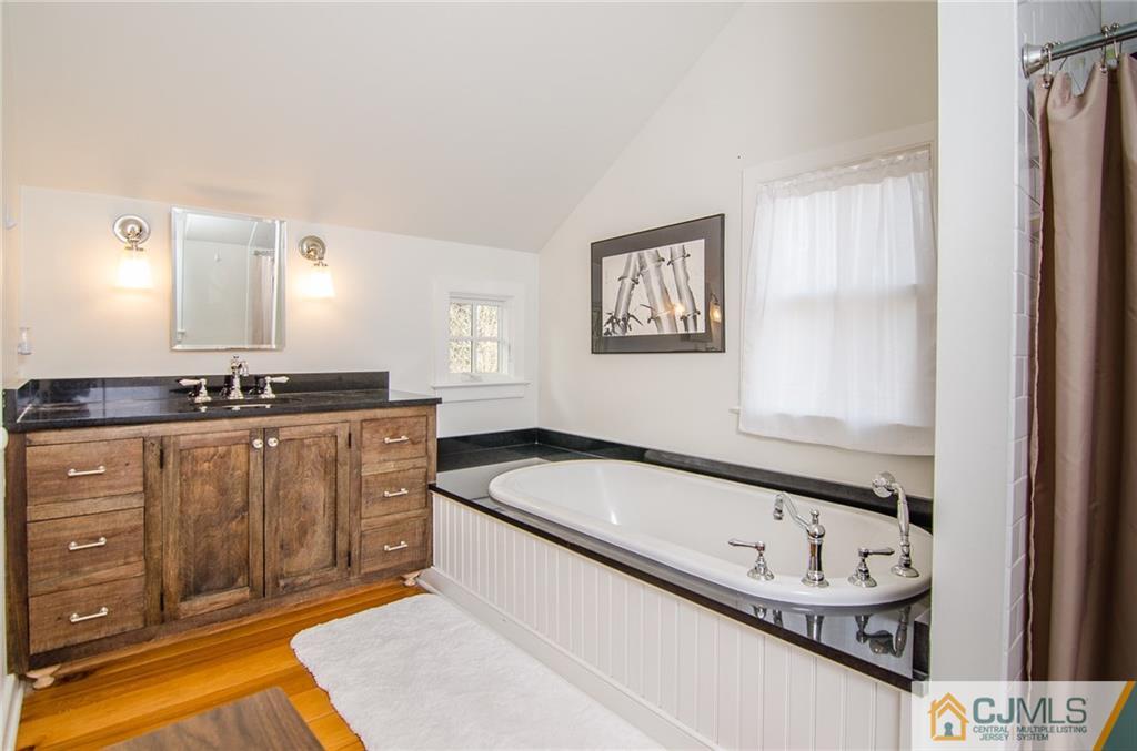 168 Plainsboro Road Cranbury, NJ 08512 - Photo 23 of 25 a kitchen with granite countertop a sink and a stove top oven