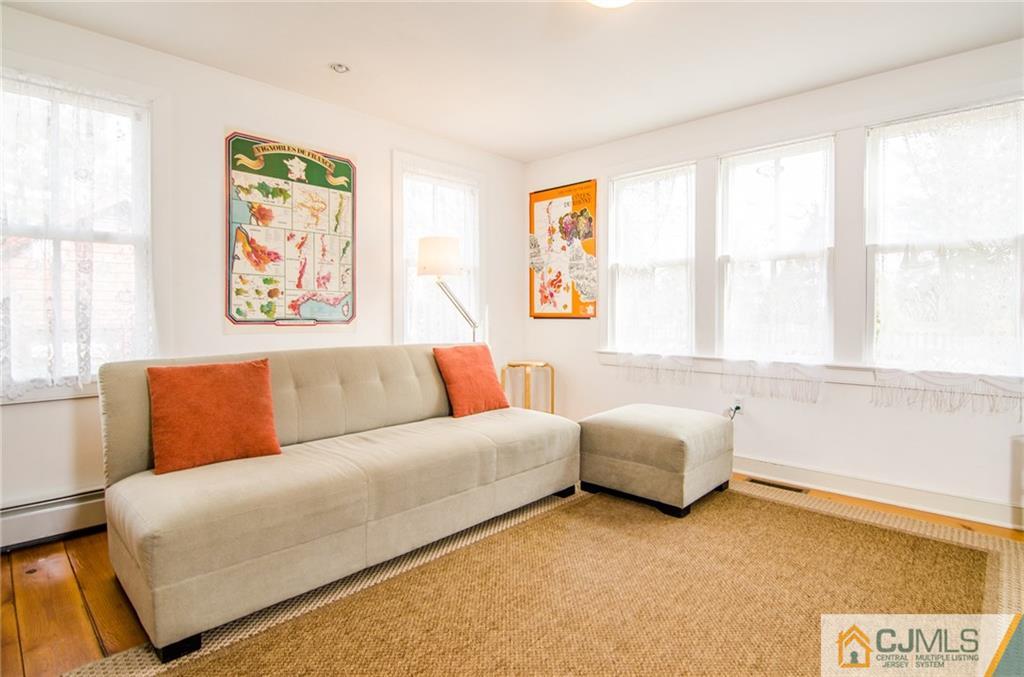 168 Plainsboro Road Cranbury, NJ 08512 - Photo 8 of 25 a living room with furniture and a large window