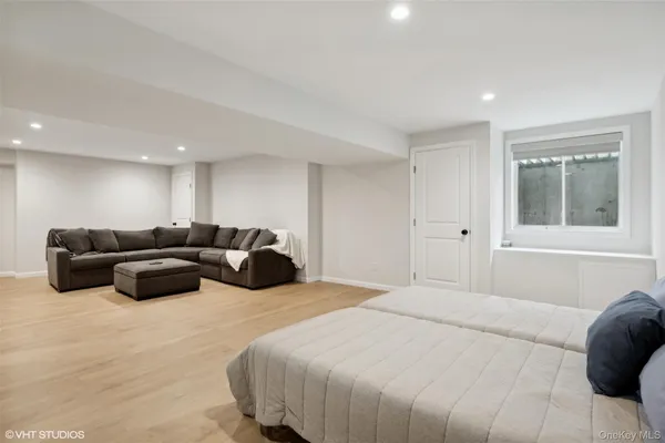 a bedroom with a bed and a couch