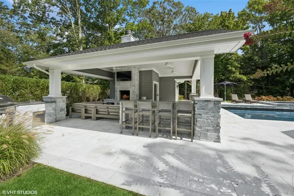 a view of a porch with furniture and garden