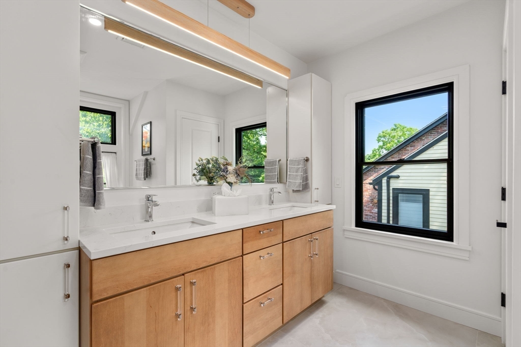 11 Ashford Road Newton, MA 02459 - Photo 19 of 41 a bathroom with a sink and a mirror