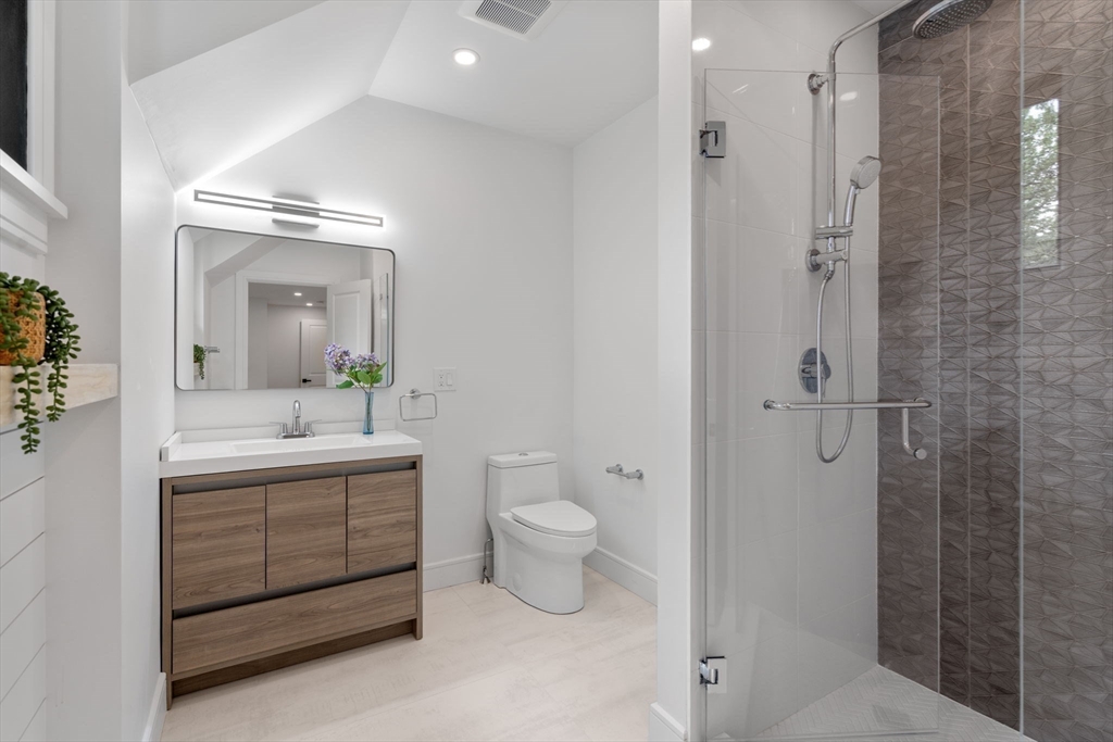 11 Ashford Road Newton, MA 02459 - Photo 23 of 41 a bathroom with a double vanity sink toilet and shower