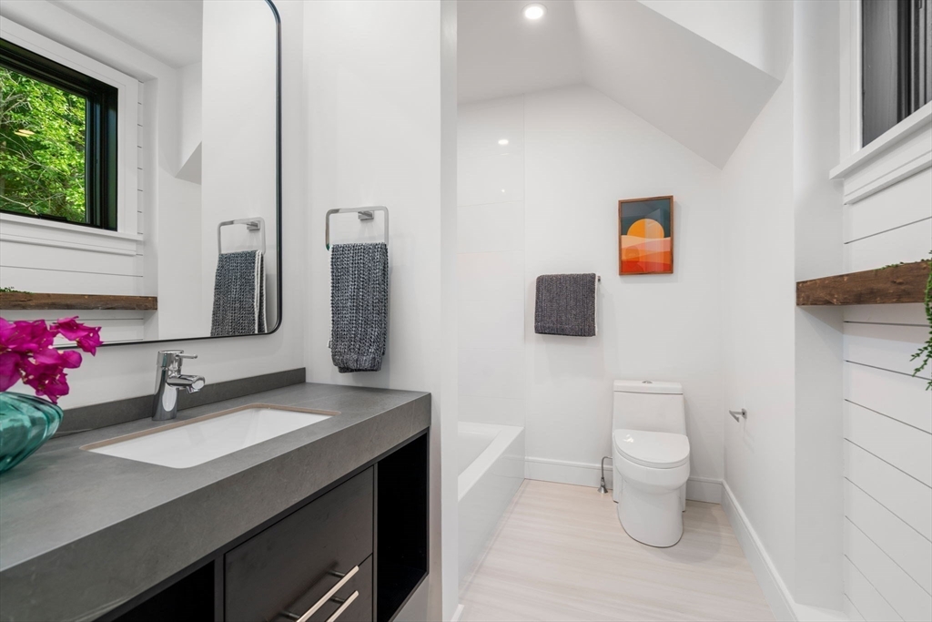 11 Ashford Road Newton, MA 02459 - Photo 25 of 41 a bathroom with a toilet sink and mirror