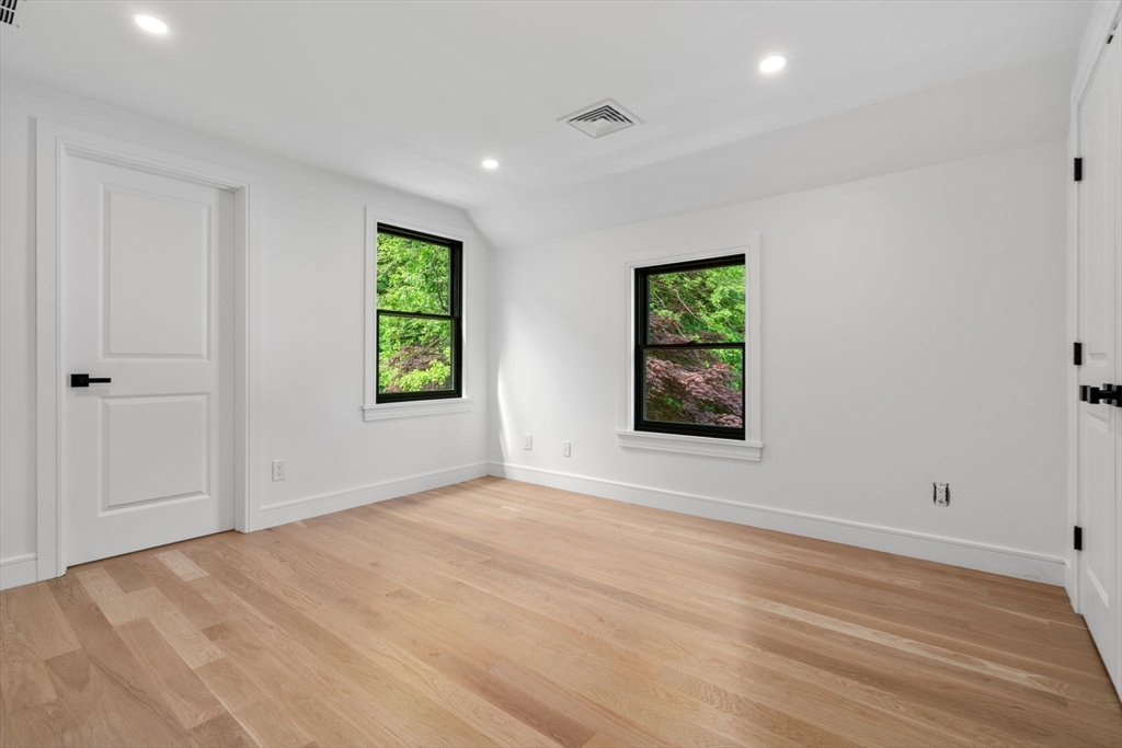 11 Ashford Road Newton, MA 02459 - Photo 30 of 41 wooden floor in an empty room with a window