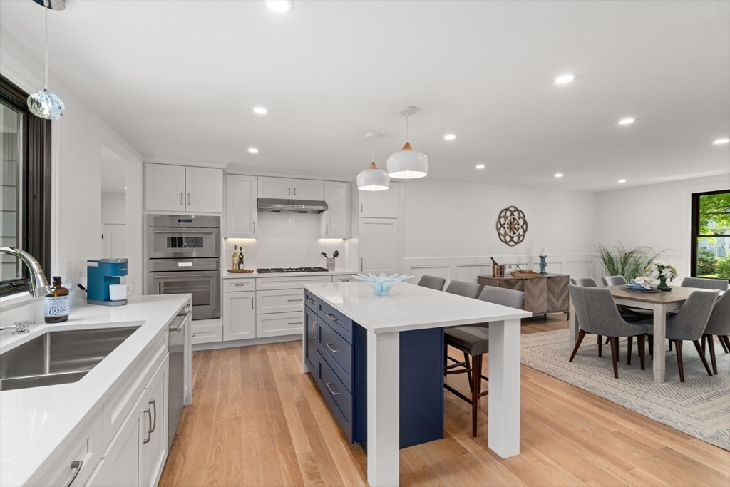 11 Ashford Road Newton, MA 02459 - Photo 5 of 41 a large kitchen with a large counter top a sink stainless steel appliances and cabinets