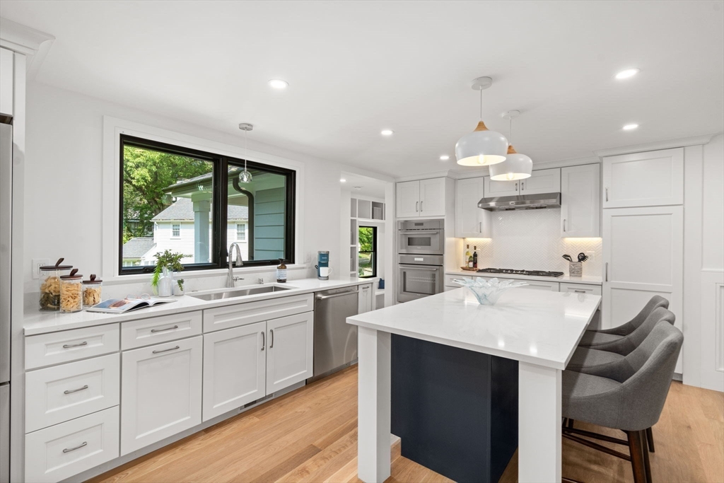 11 Ashford Road Newton, MA 02459 - Photo 6 of 41 a large kitchen with kitchen island a sink table and chairs