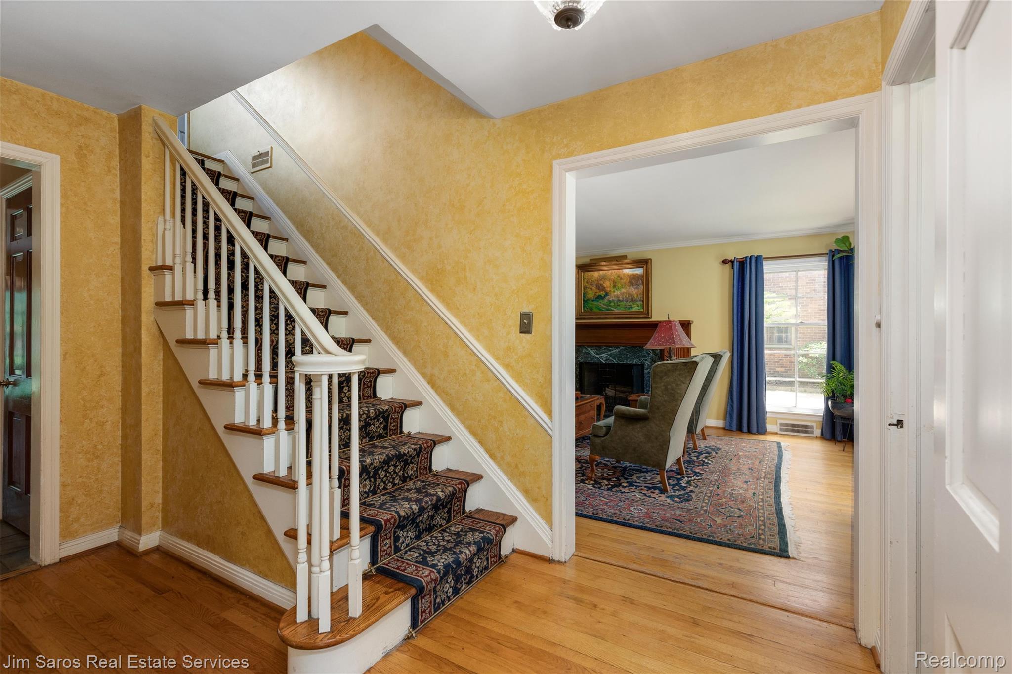 820 Westchester Road Grosse Pointe, MI 48230 - Photo 17 of 33 Stairway featuring hardwood / wood-style flooring and baseboards