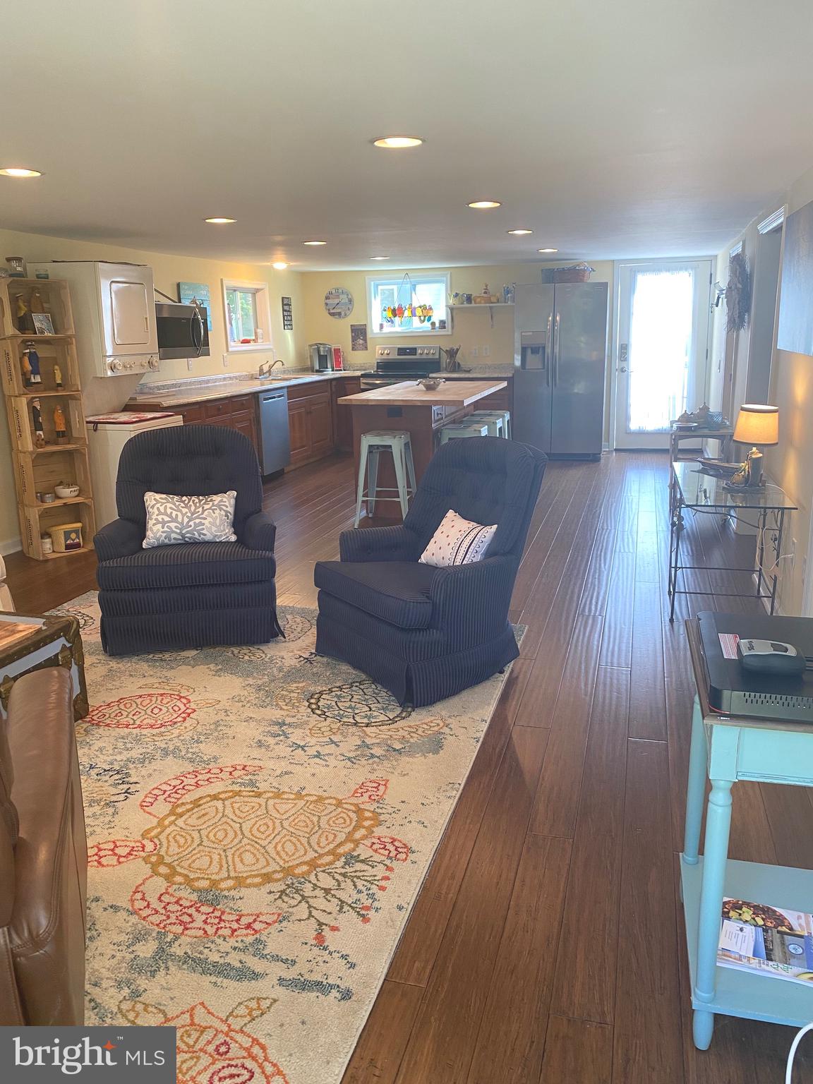 20805 Severn Road Ewell, MD 21824 - Photo 10 of 27 a living room with furniture and a wooden floor