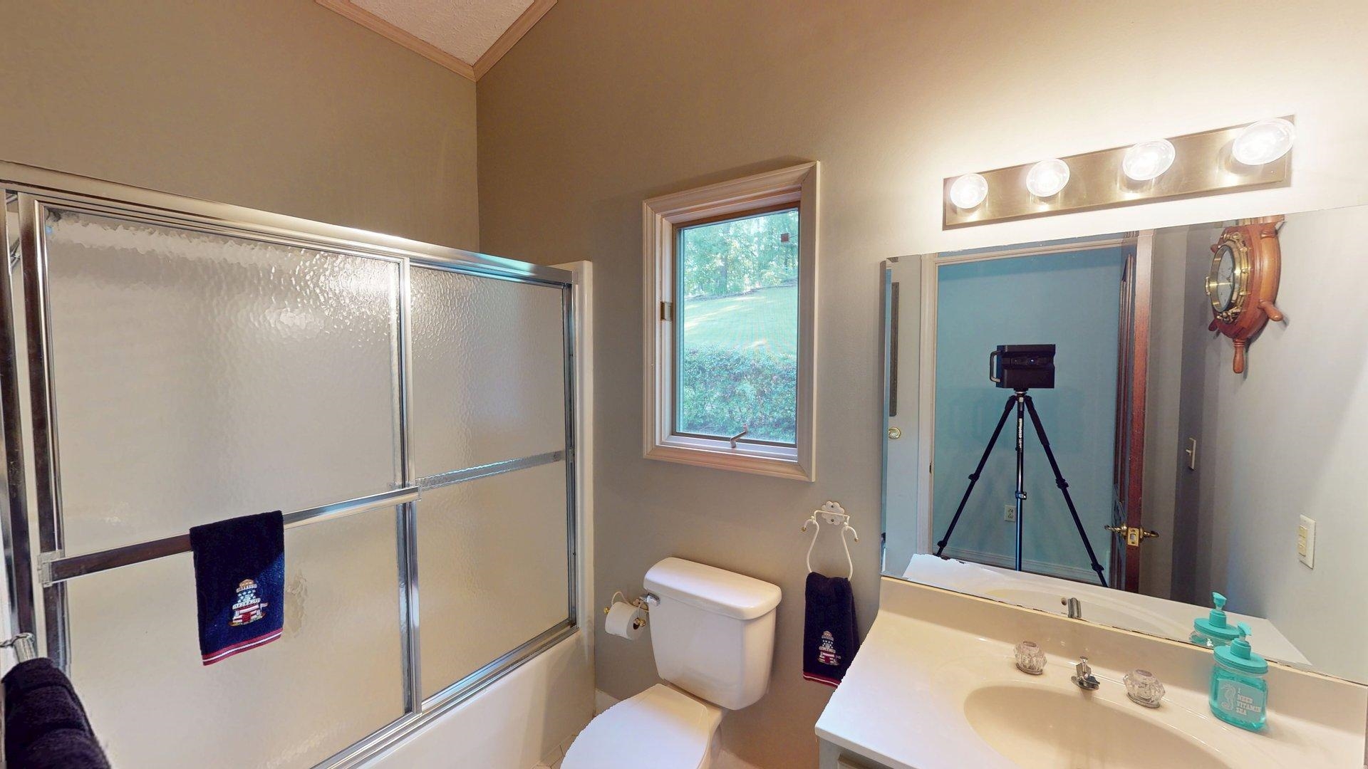 650 Caney Hollow Road Counce, TN 38326 - Photo 35 of 40 a bathroom with a sink and a mirror