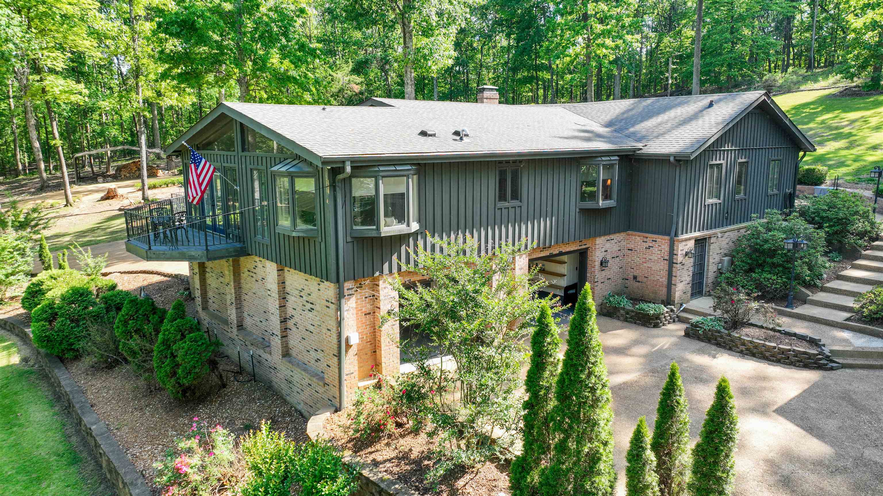 650 Caney Hollow Road Counce, TN 38326 - Photo 4 of 40 a view of a house with a yard potted plants and a large tree