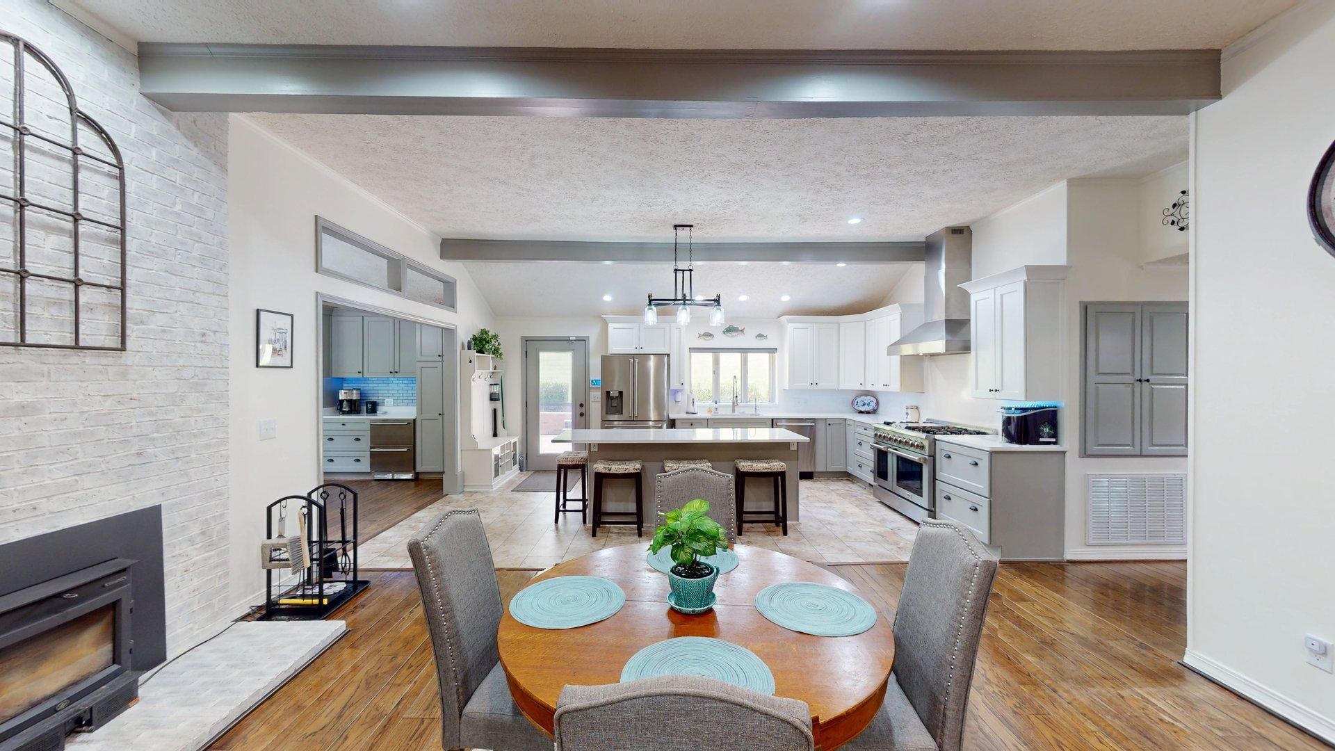 650 Caney Hollow Road Counce, TN 38326 - Photo 8 of 40 a view of a dining room with furniture a kitchen and chandelier