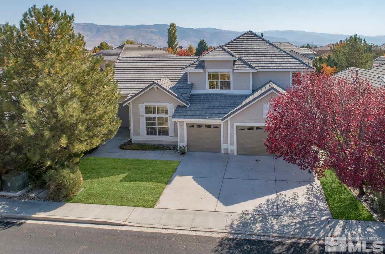 1580 Sutterbrook Way Reno, NV 89521 - Photo 1 of 25 a front view of a house with a yard and garage