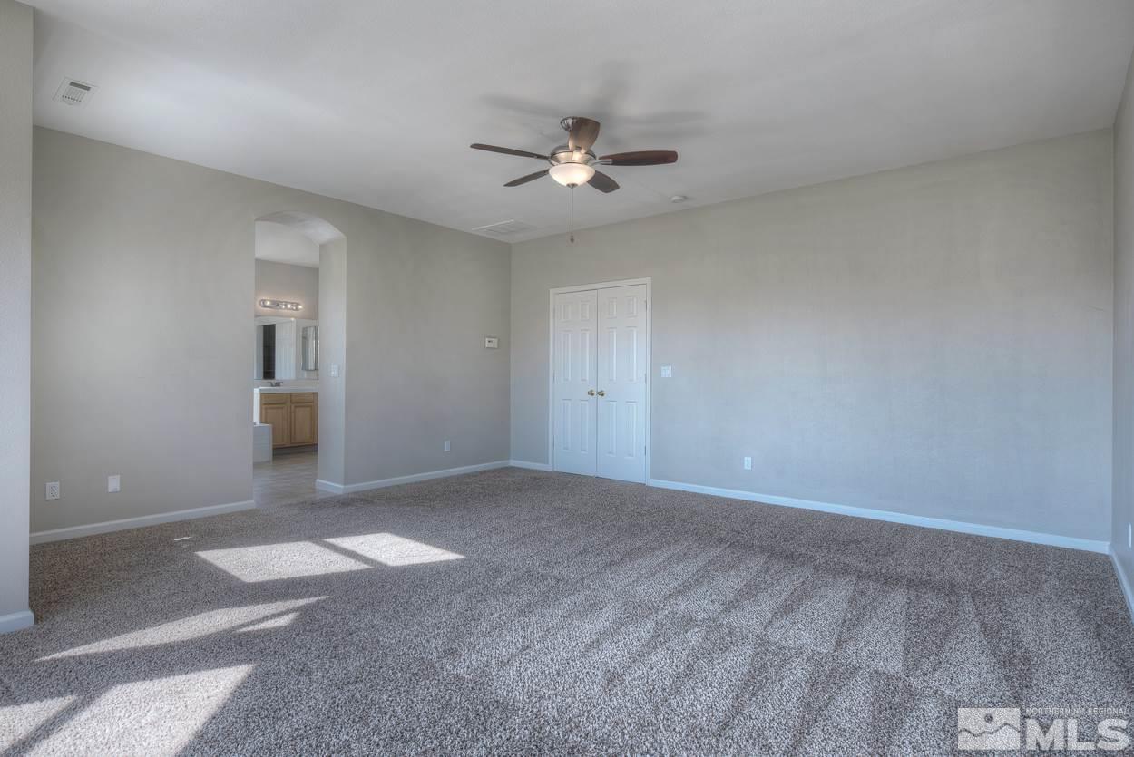 1580 Sutterbrook Way Reno, NV 89521 - Photo 14 of 25 a view of an empty room with a ceiling fan