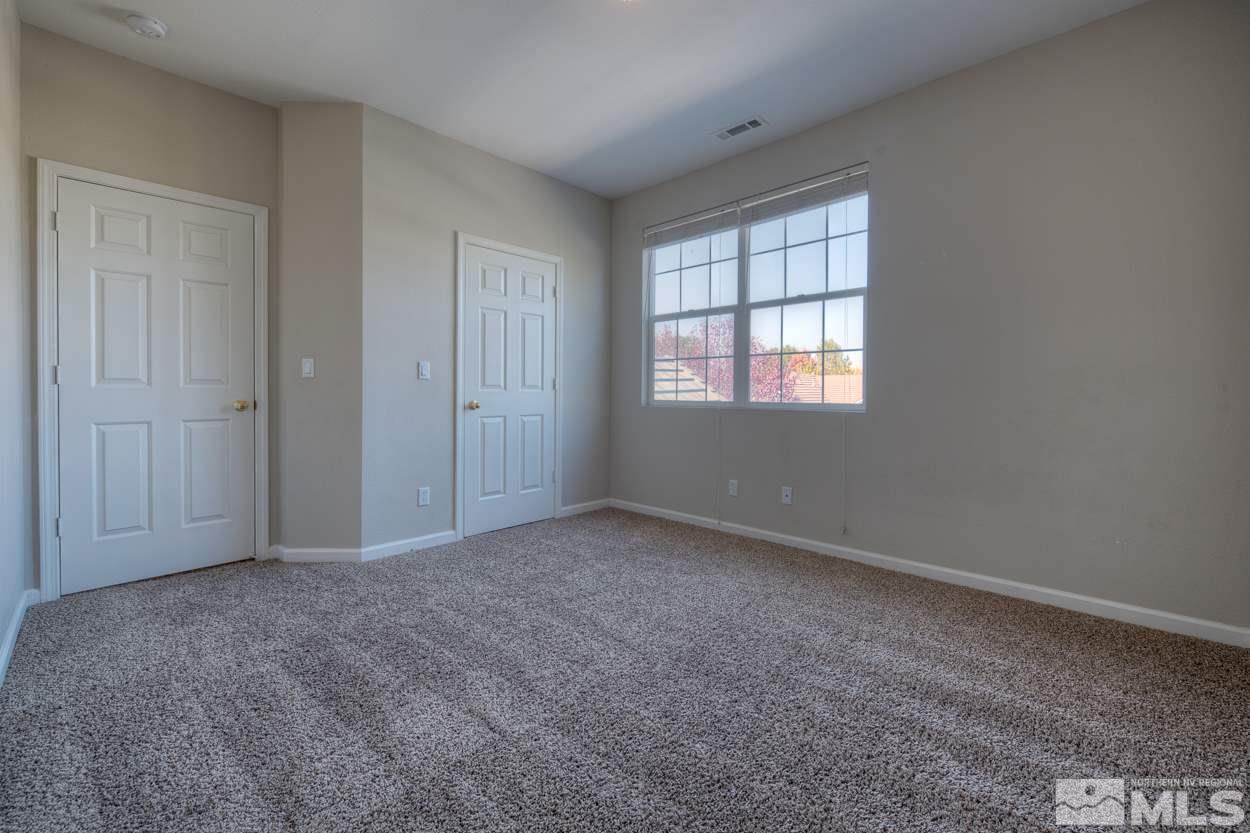 1580 Sutterbrook Way Reno, NV 89521 - Photo 17 of 25 an empty room with windows