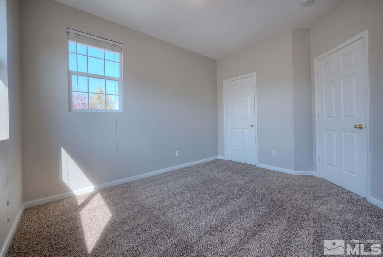 1580 Sutterbrook Way Reno, NV 89521 - Photo 18 of 25 an empty room with windows