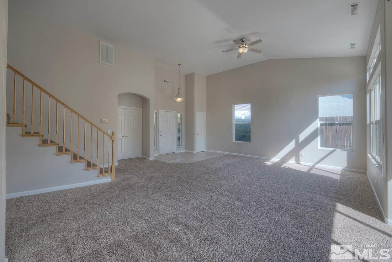 1580 Sutterbrook Way Reno, NV 89521 - Photo 4 of 25 a view of a hallway with staircase