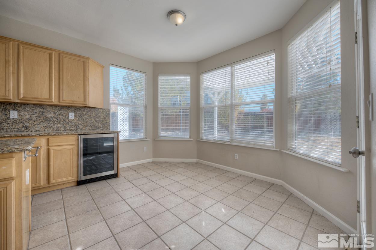 1580 Sutterbrook Way Reno, NV 89521 - Photo 9 of 25 a kitchen with a white cabinets and window