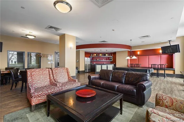 a living room with furniture and a breakfast area