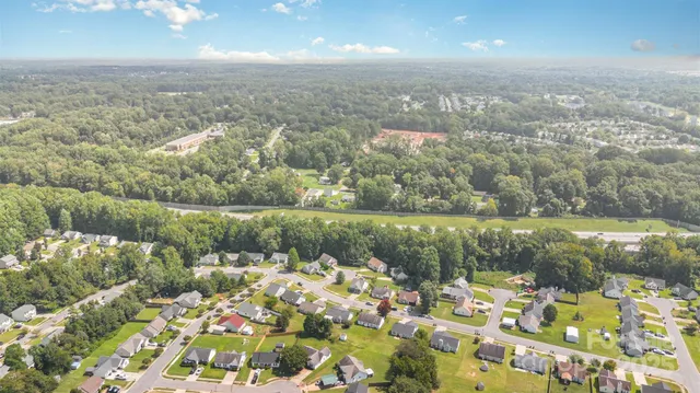 an aerial view of a house with a lake view