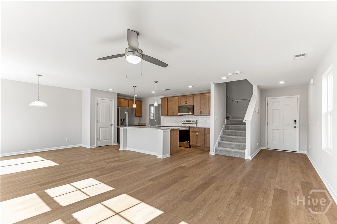 221 Hasty Point Road Rincon, GA 31326 - Photo 5 of 40 Great Room and Kitchen different angle
