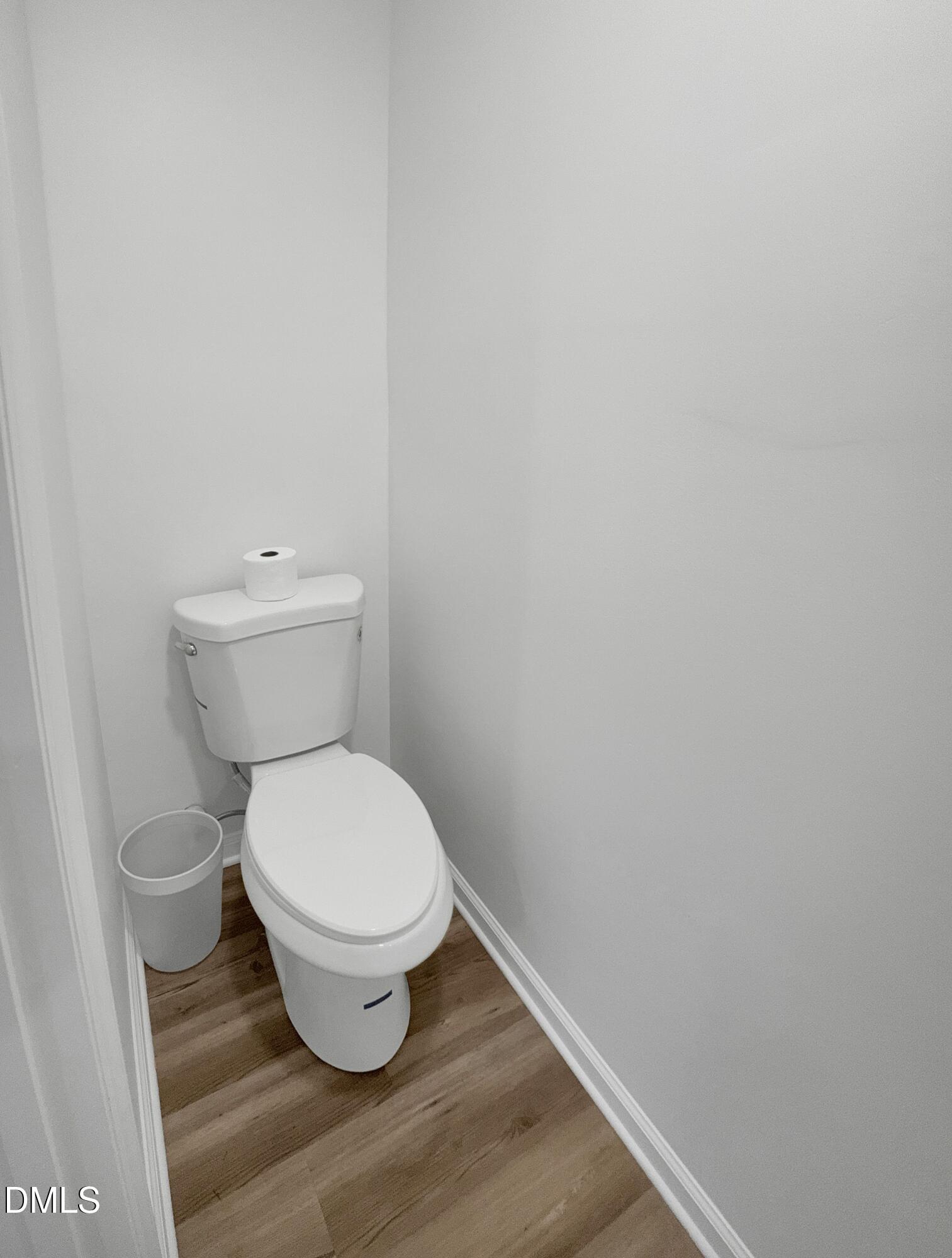 2816 Smoke Place Raleigh, NC 27610 - Photo 11 of 21 a white toilet sitting next to a white wall