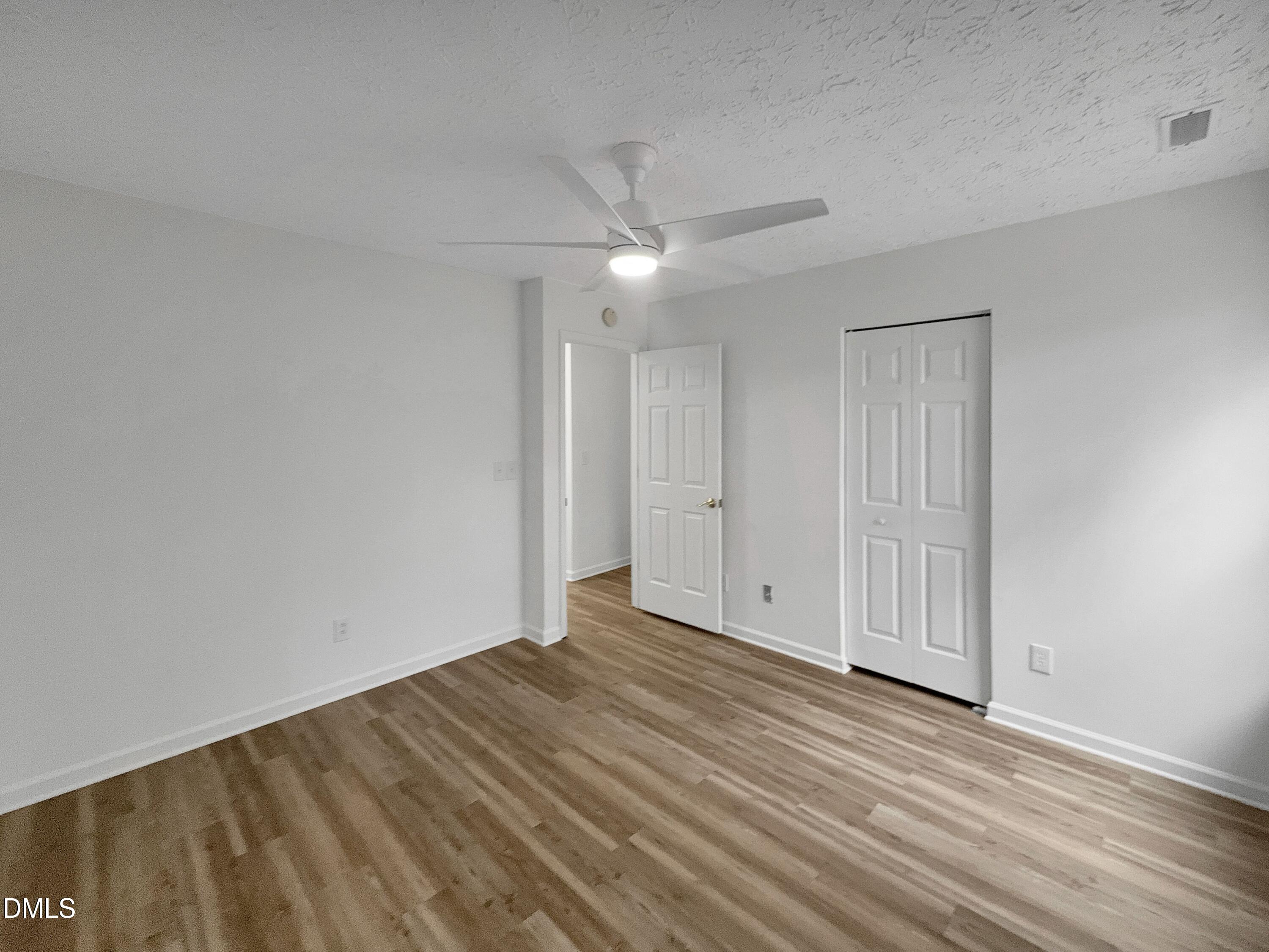2816 Smoke Place Raleigh, NC 27610 - Photo 16 of 21 a view of an empty room with wooden floor
