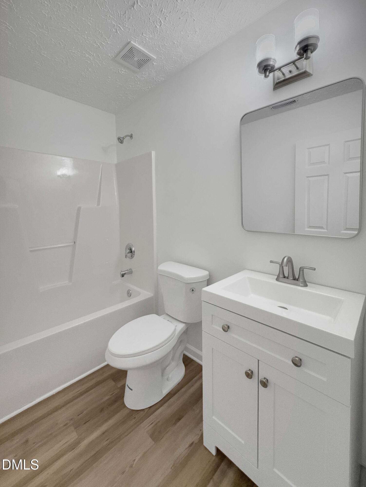 2816 Smoke Place Raleigh, NC 27610 - Photo 18 of 21 a bathroom with a sink a toilet and a bathtub