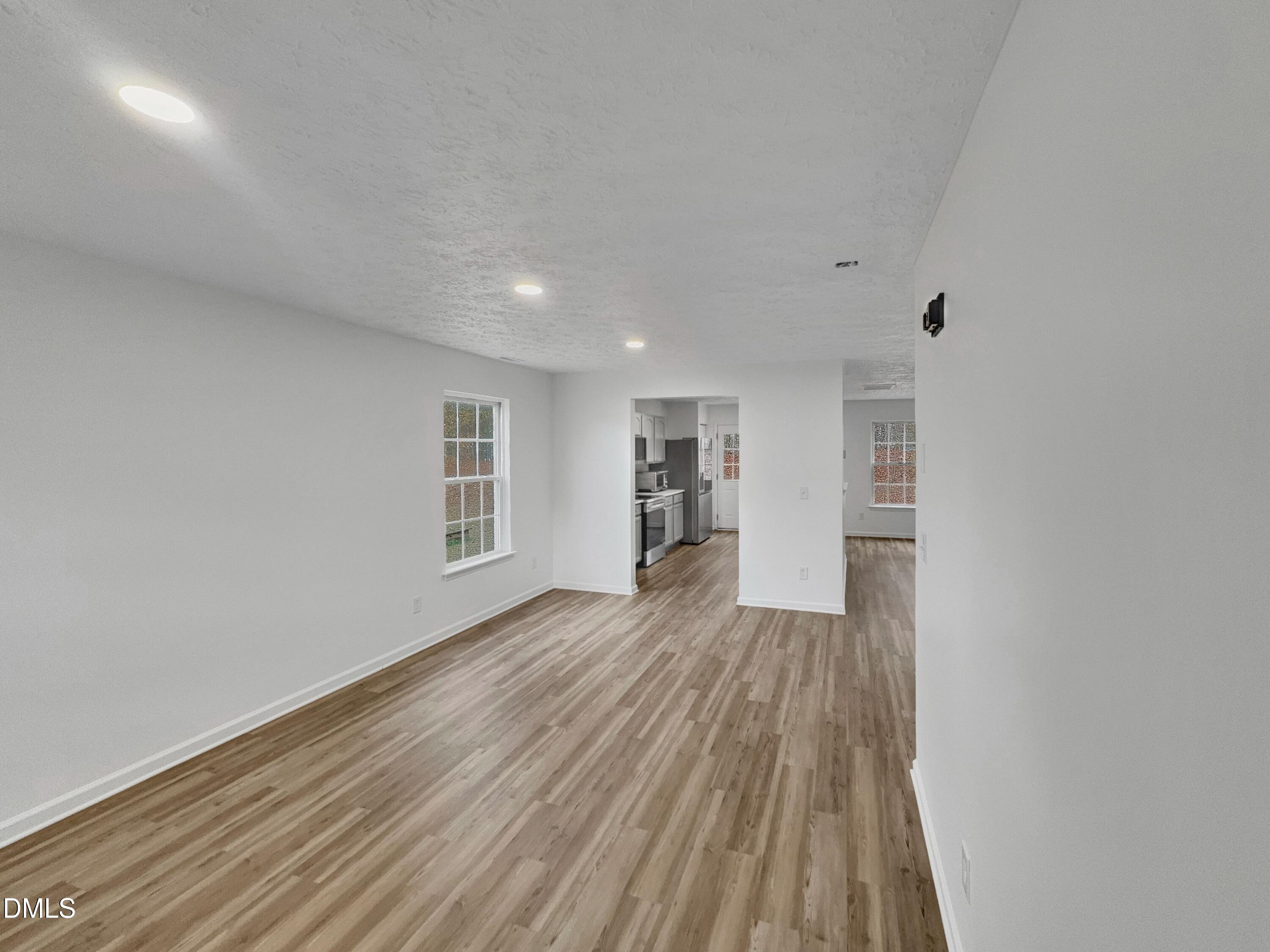 2816 Smoke Place Raleigh, NC 27610 - Photo 2 of 21 a view of wooden floor and windows in a room