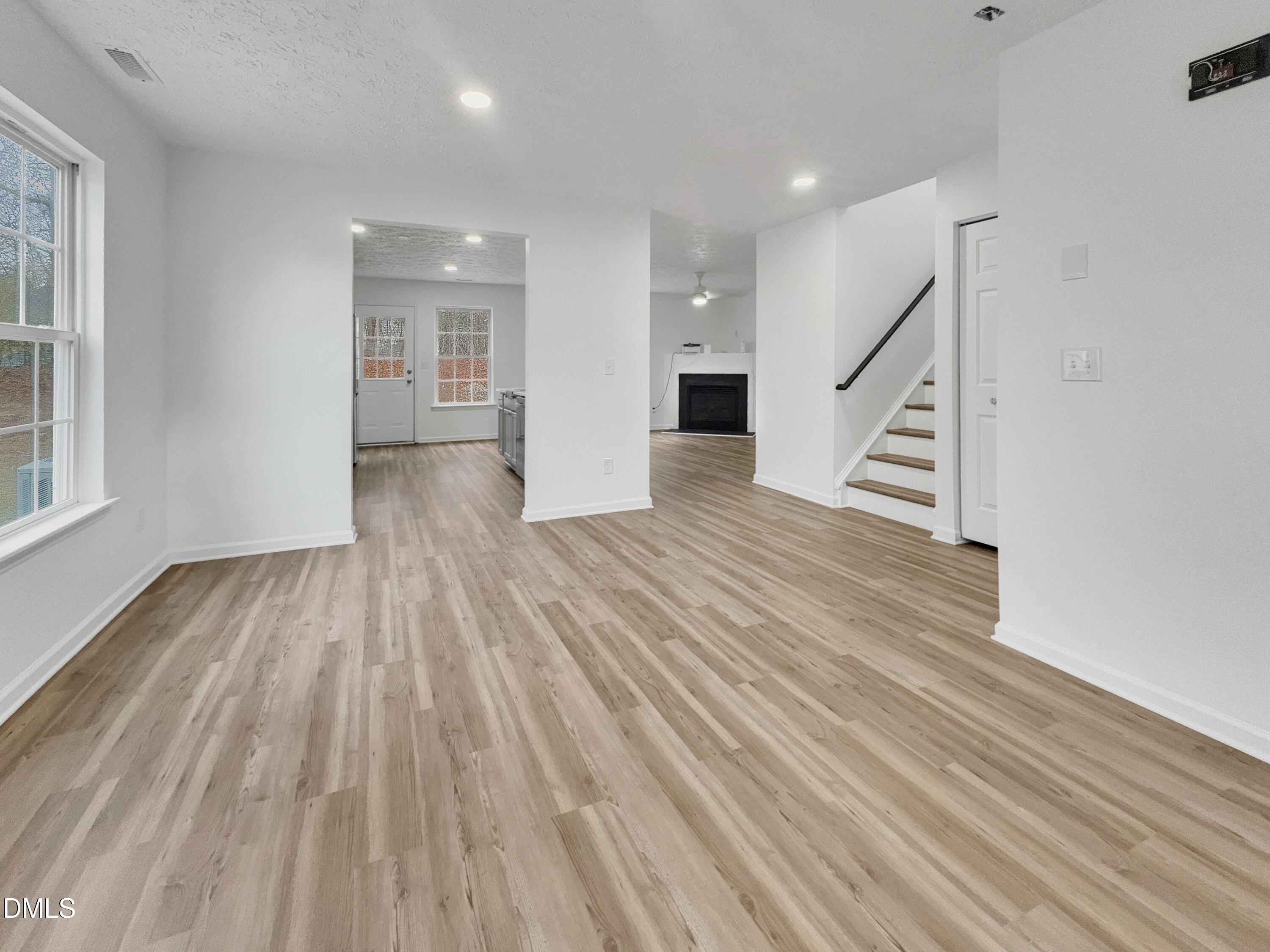 2816 Smoke Place Raleigh, NC 27610 - Photo 4 of 21 wooden floor in an empty room with a window