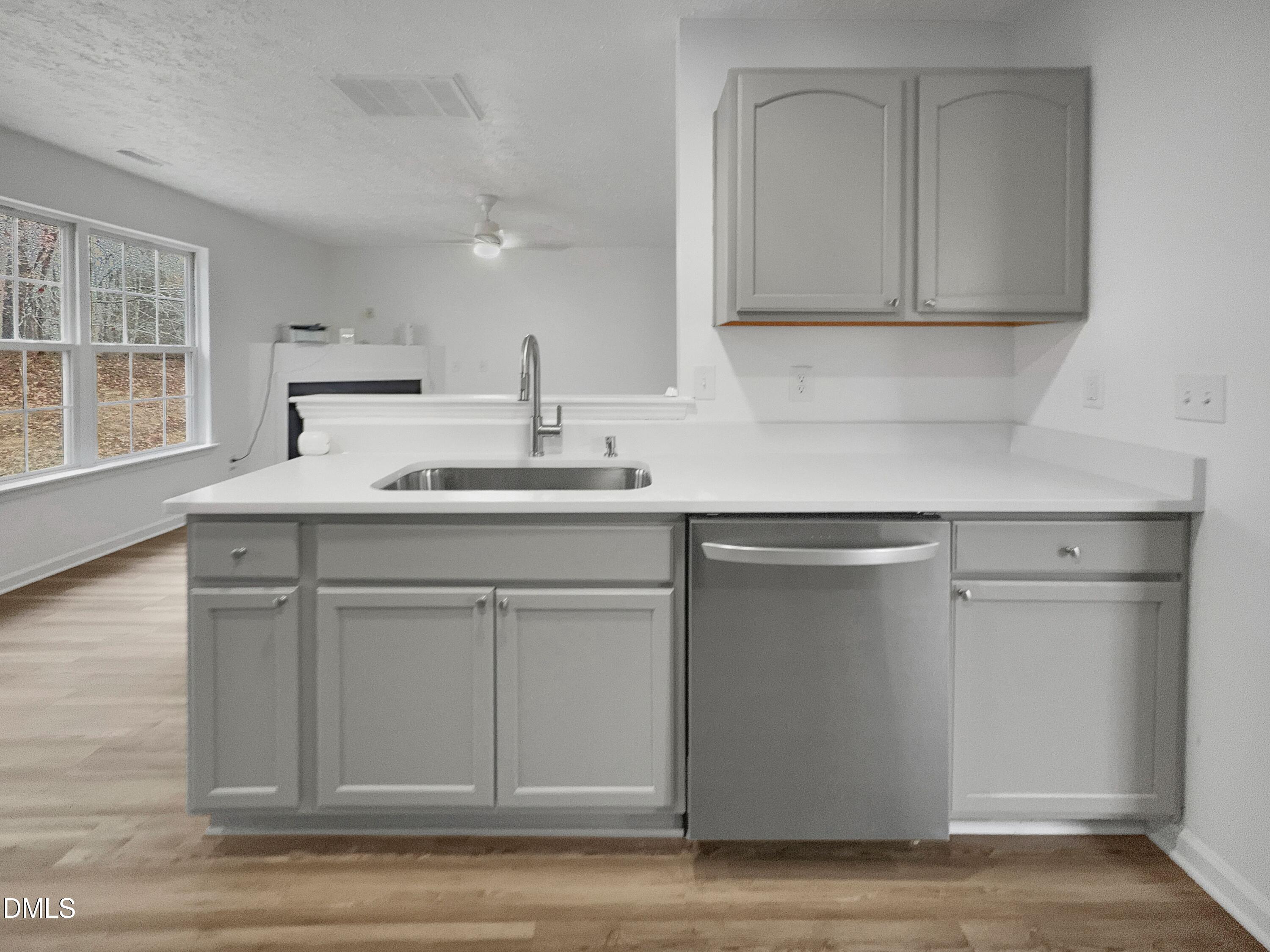 2816 Smoke Place Raleigh, NC 27610 - Photo 7 of 21 a kitchen with a sink cabinets and a window