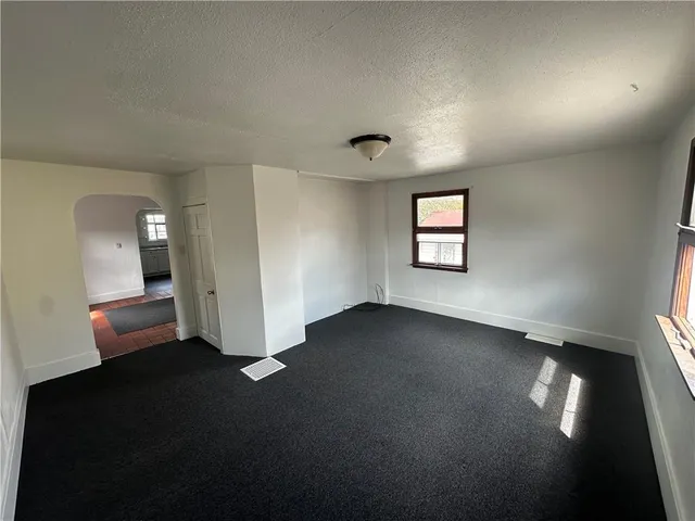 en empty room with windows