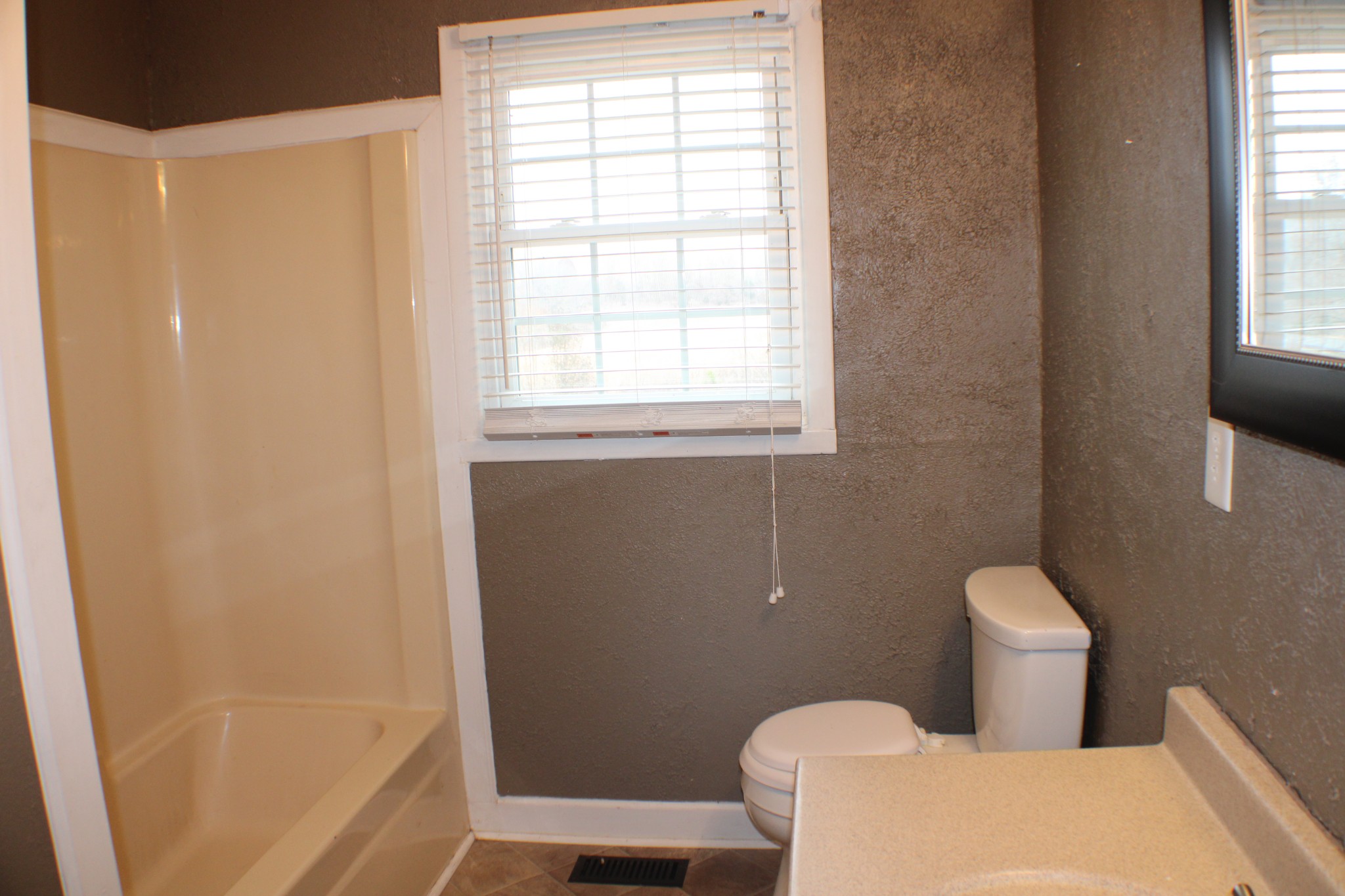 366 Pea Ridge Road Woodbury, TN 37190 - Photo 14 of 25 a white toilet sitting next to a window in a bathroom