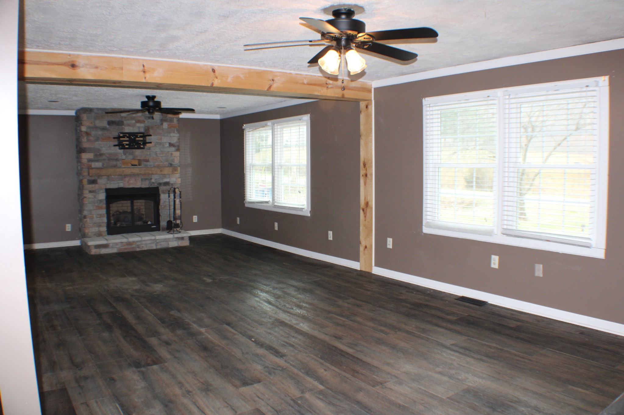 366 Pea Ridge Road Woodbury, TN 37190 - Photo 5 of 25 a view of an empty room with wooden floor and a window