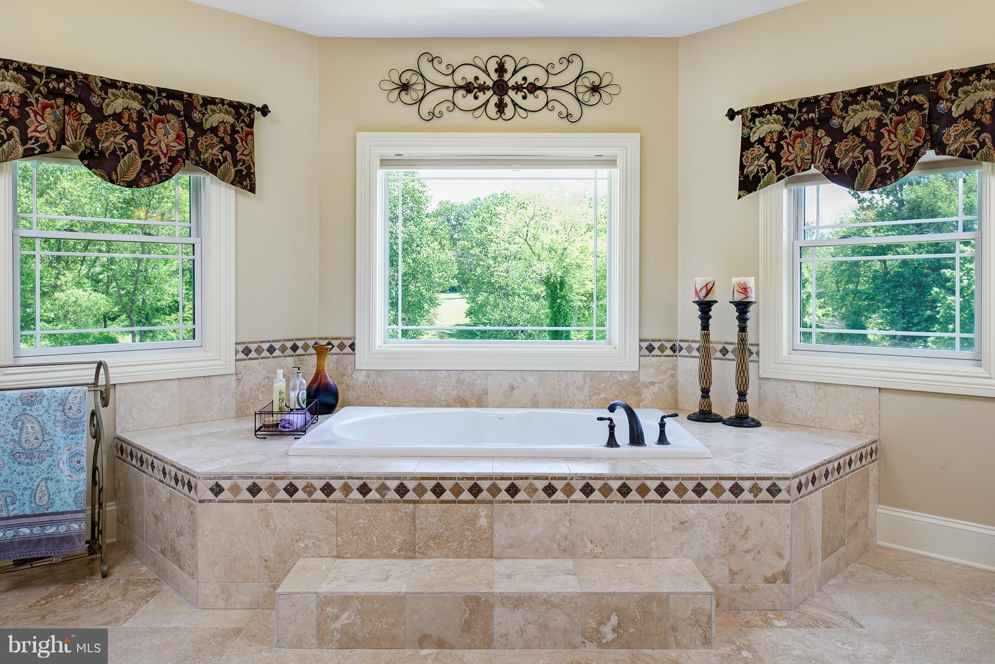 835 Walker Road Great Falls, VA 22066 - Photo 22 of 30 Jacuzzi tub with travertine tile for relaxing
