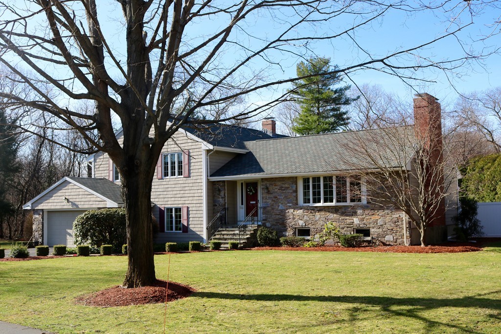 959 Brook Road Milton, MA 02186 - Photo 1 of 30 a front view of a house with a yard