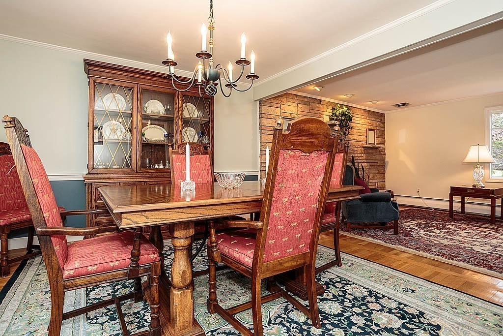 959 Brook Road Milton, MA 02186 - Photo 13 of 30 a view of a dining room with furniture and wooden floor