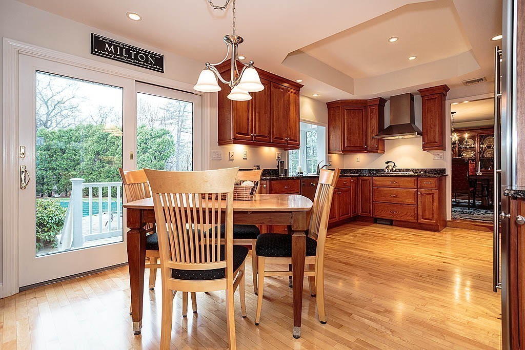 959 Brook Road Milton, MA 02186 - Photo 15 of 30 a view of a dining room with furniture window and wooden floor