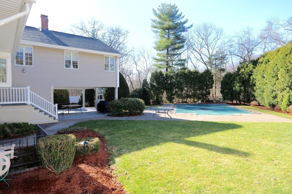 959 Brook Road Milton, MA 02186 - Photo 4 of 30 a front view of a house with swimming pool having outdoor seating