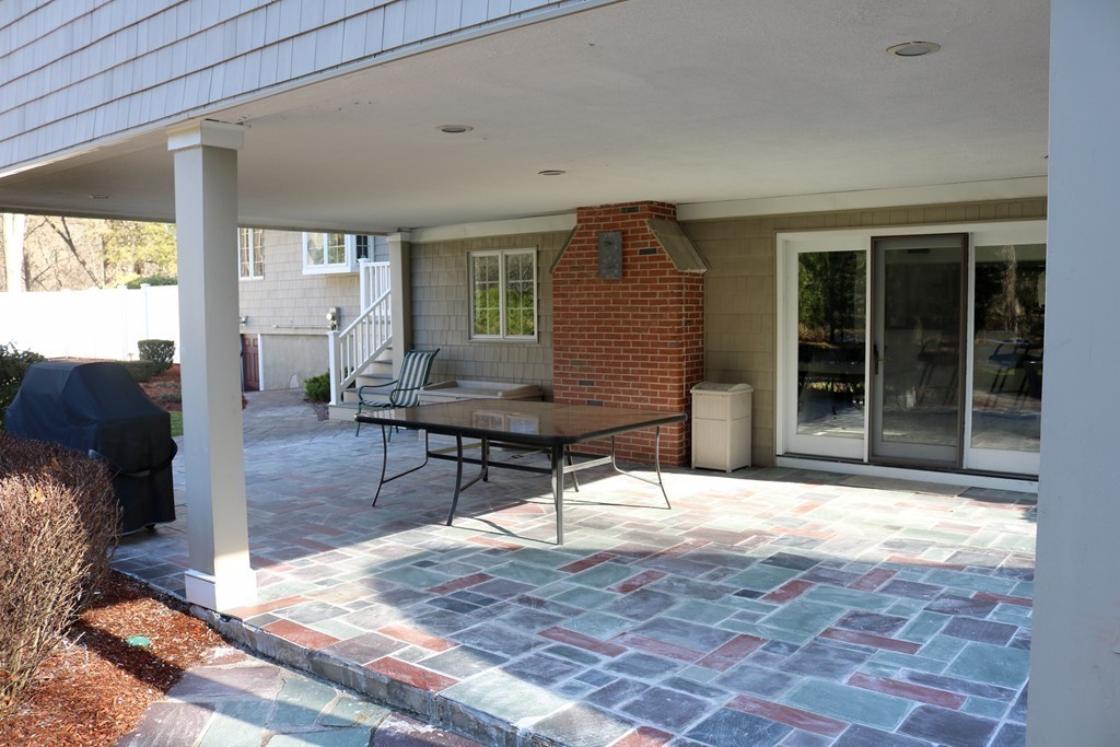 959 Brook Road Milton, MA 02186 - Photo 8 of 30 a building outdoor space with patio furniture and potted plants
