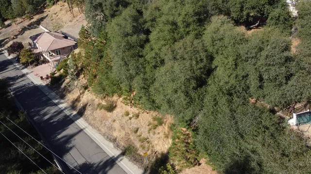 an aerial view of house with yard