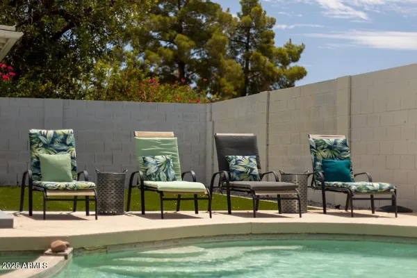 a view of a chairs and table in a patio