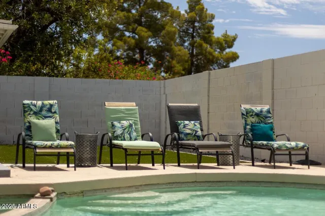 a view of a chairs and table in a patio
