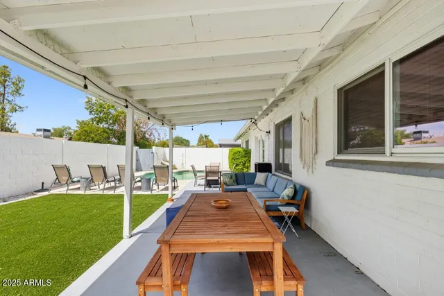 a view of swimming pool with a patio