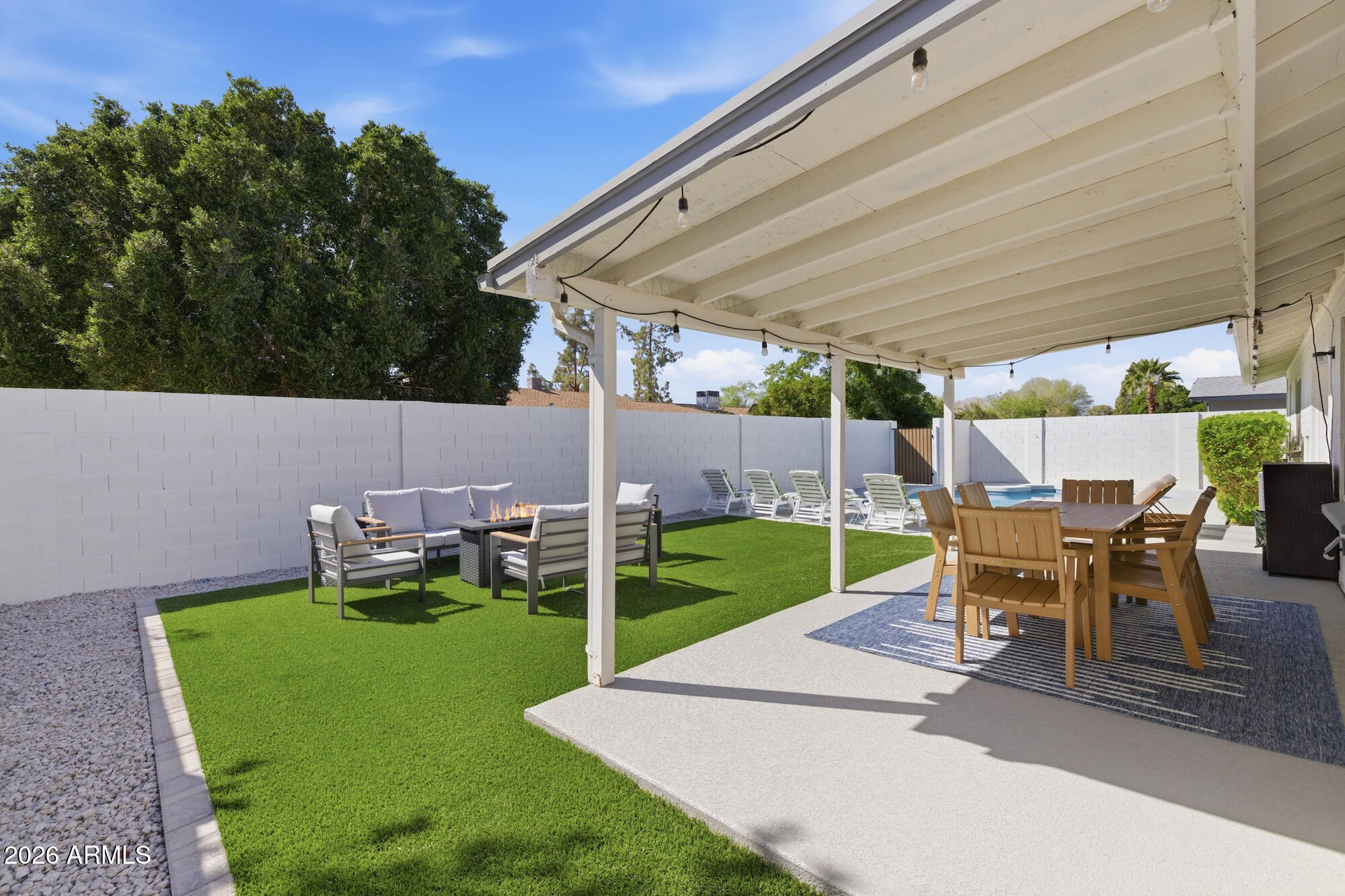2163 East Sesame Street Tempe, AZ 85283 - Photo 16 of 19 a view of yard with table and chairs under an umbrella
