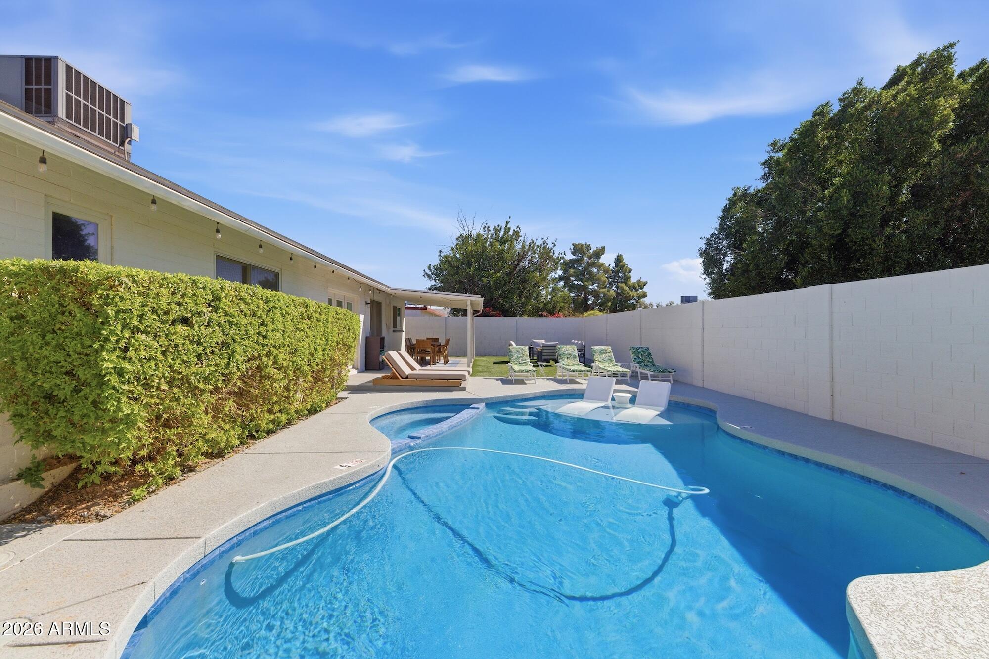 2163 East Sesame Street Tempe, AZ 85283 - Photo 19 of 19 a view of a swimming pool with a patio