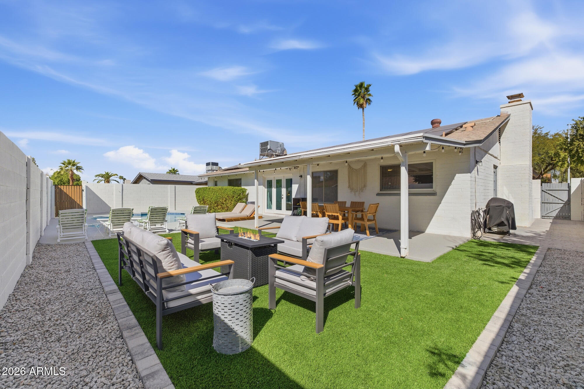 2163 East Sesame Street Tempe, AZ 85283 - Photo 3 of 19 a view of a house with backyard sitting area and garden