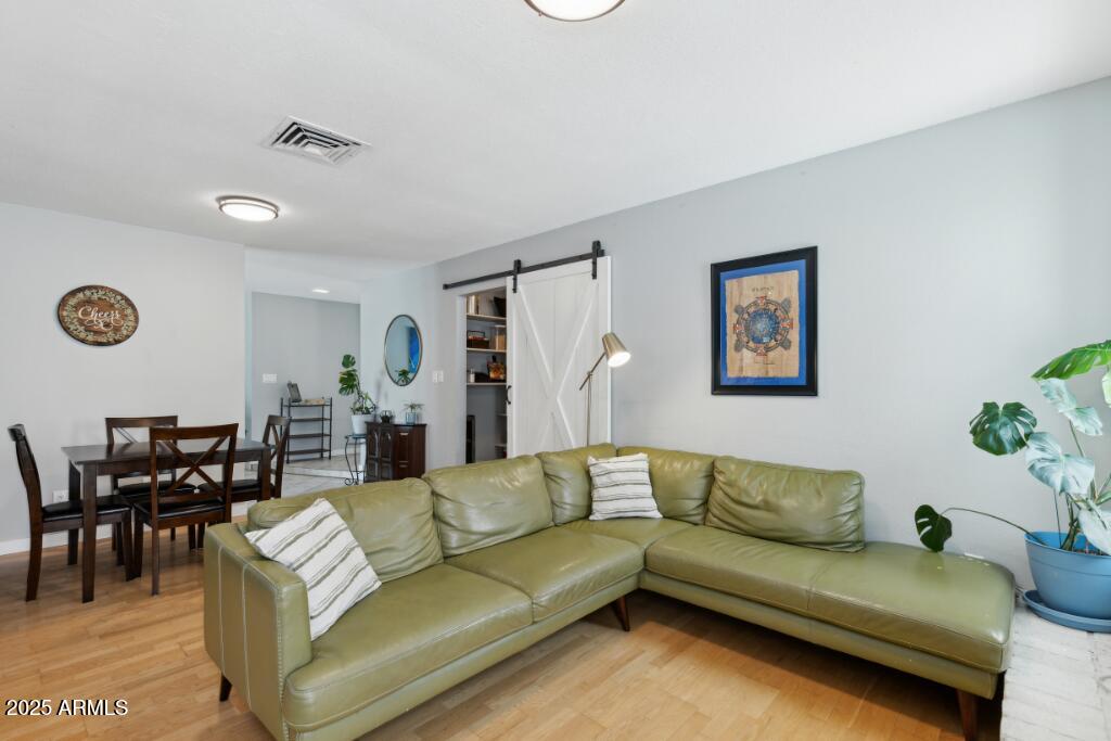 2163 East Sesame Street Tempe, AZ 85283 - Photo 6 of 19 a living room with furniture and wooden floor