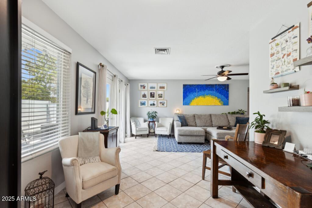 2163 East Sesame Street Tempe, AZ 85283 - Photo 7 of 16 a living room with furniture and a flat screen tv