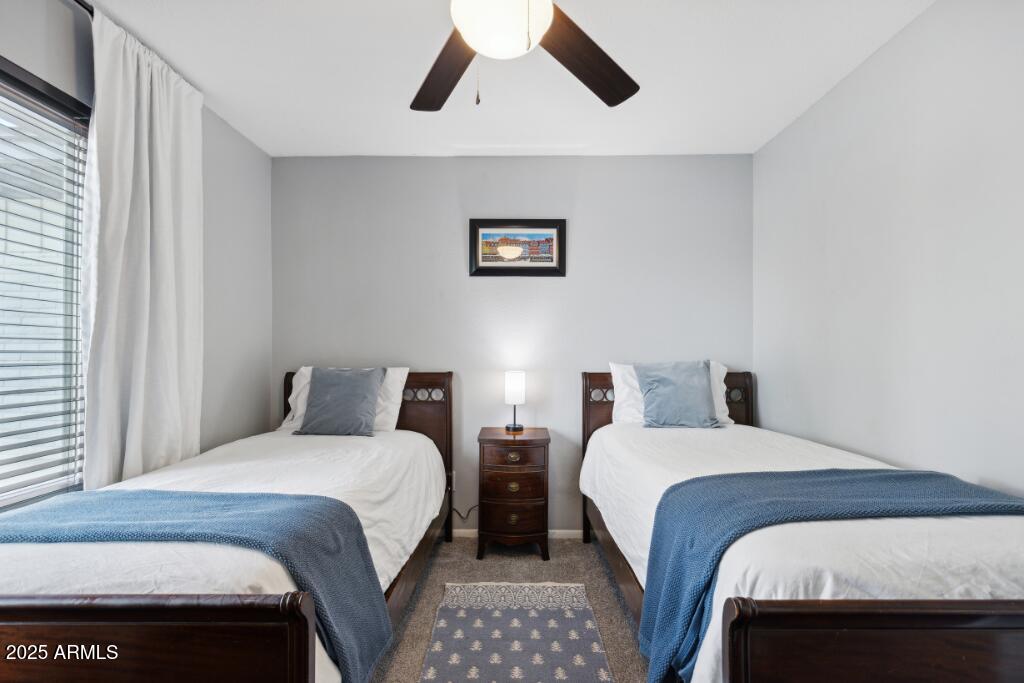 2163 East Sesame Street Tempe, AZ 85283 - Photo 10 of 19 a bedroom with two beds and a painting on the wall